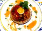 Photo recette Crumpet fondue de Provence œuf de caille chorizo de Bellota